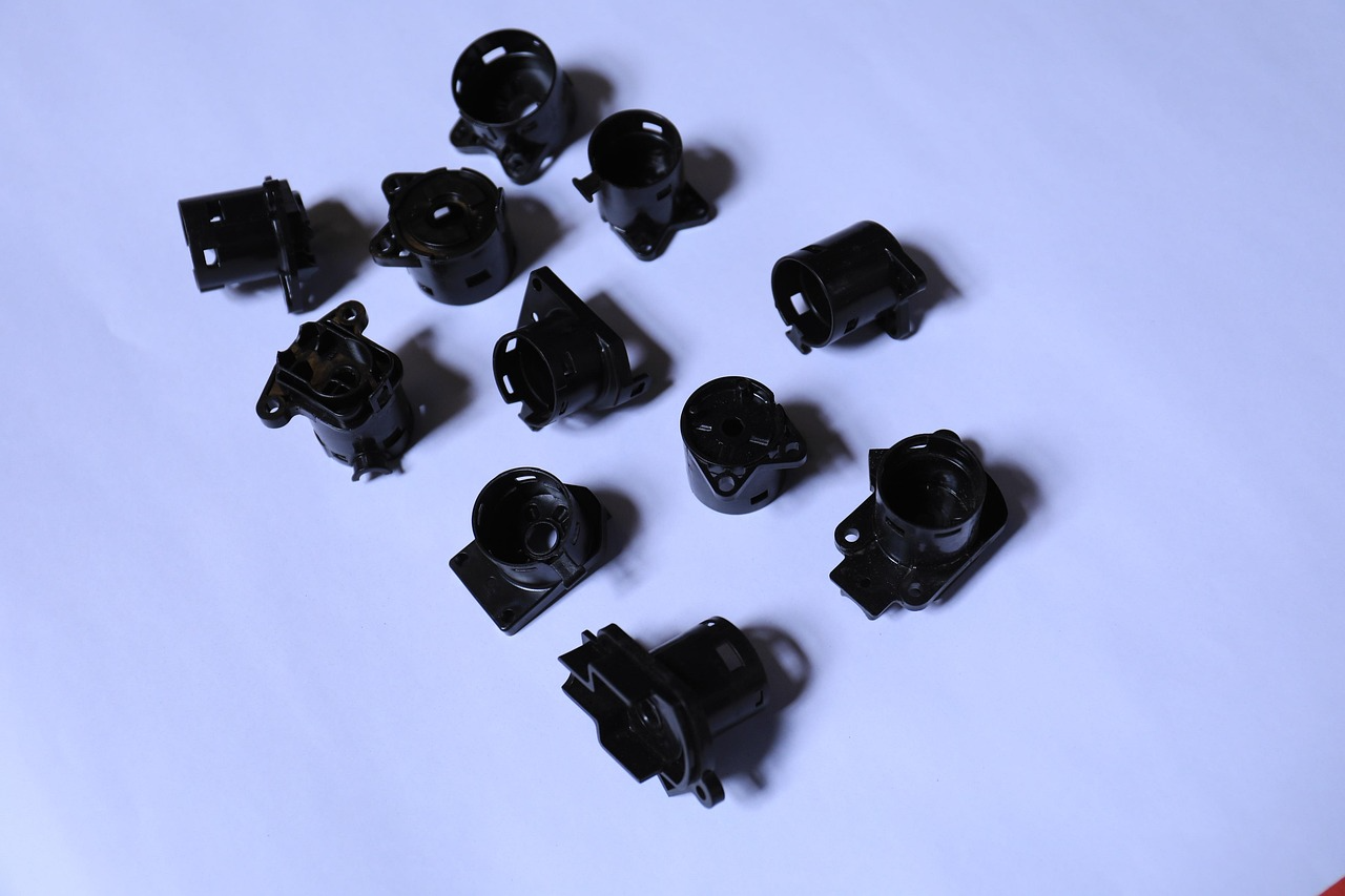 Injection molded plastic components. A saved reference spectrum lets a molded part be checked against its specified material. Black or carbon filled parts such as these absorb strongly and can be harder to analyze by FTIR.